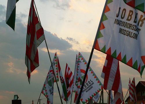 Supporters wave flags of Jobbik, an anti-Semitic Hungarian political party | CC via flickr user Leigh Phillips