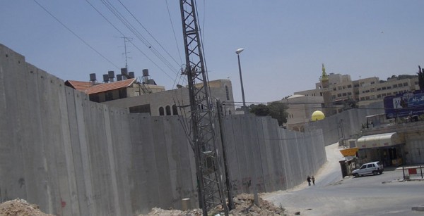 The Israeli West Bank Barrier at Abu Dis. | CC via Wikimedia Commons