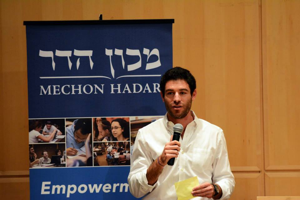 Yoav Schaefer speaking at the Symposium | via Facebook.