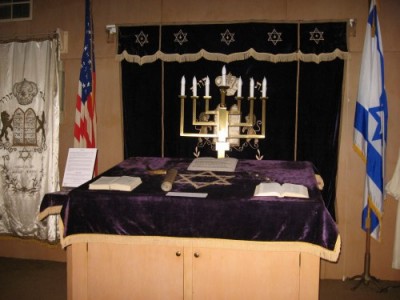 Must we always choose our place between these flags? | Image of the bima at Beth Israel Synagogue, Stevens Point, WI taken from their website.