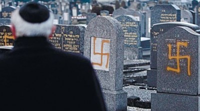 A Jewish cemetery in France defiled with swastikas.