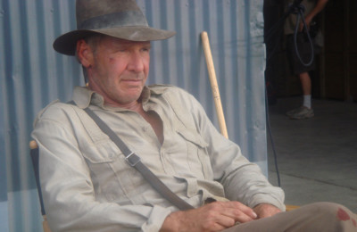 Harrison Ford on the set of Indiana Jones and the Kingdom of the Crystal Skull. | By John Griffiths, [CC BY-SA 2.0] via Wikimedia Commons