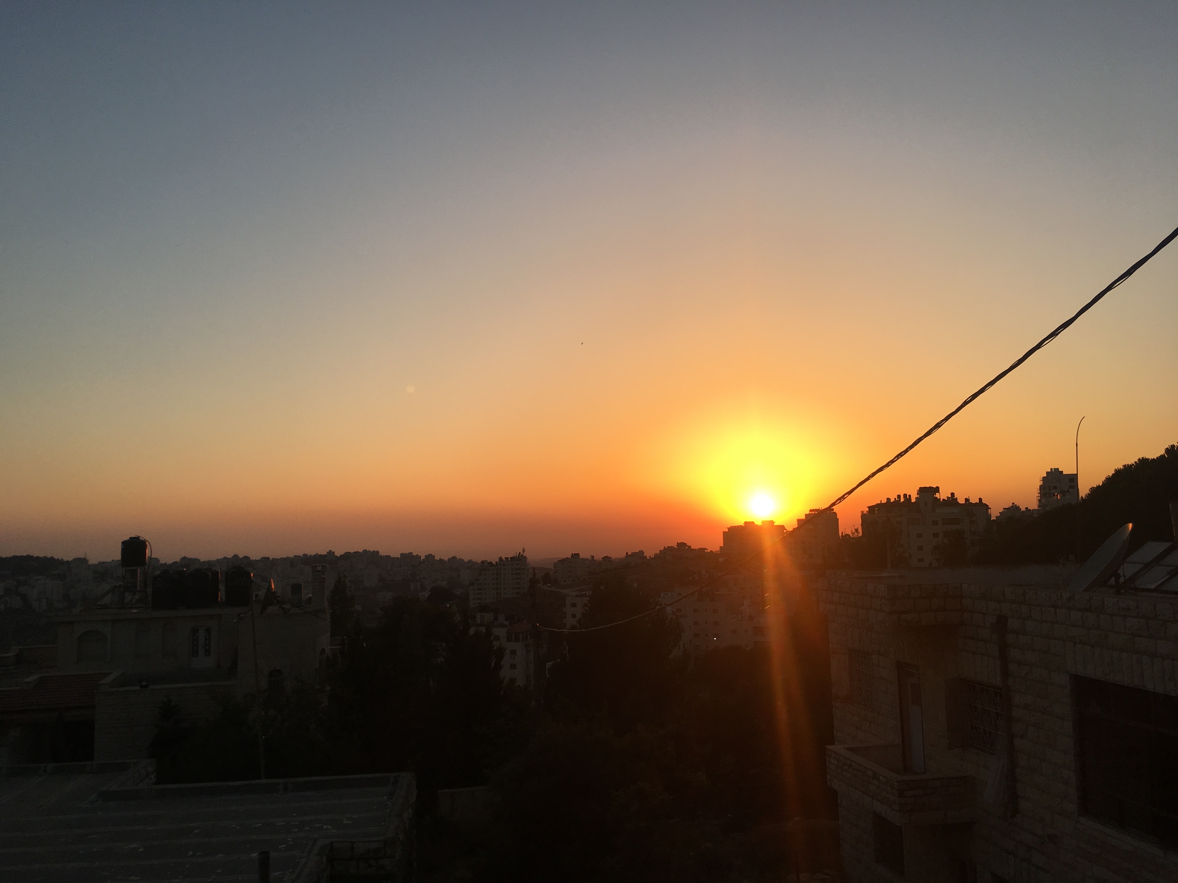 The sunset over the Palestinian city Ramallah, in the West Bank. Photo by Nesha Ruther. 
