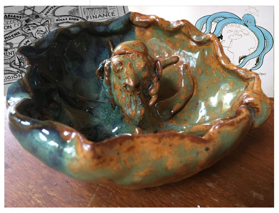 A pottery bowl with a stereotypical depiction of a Jewish man's head with tentacles cascading into a bowl. Two depictions of old antisemitic canards float in the background.