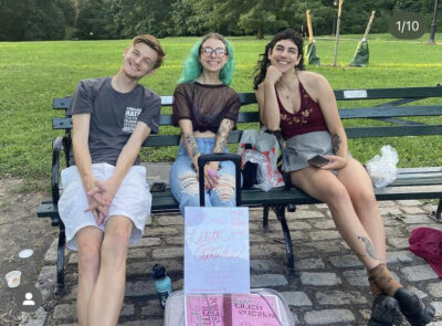 Zinemakers gather on a park bench in Central Park in New York City