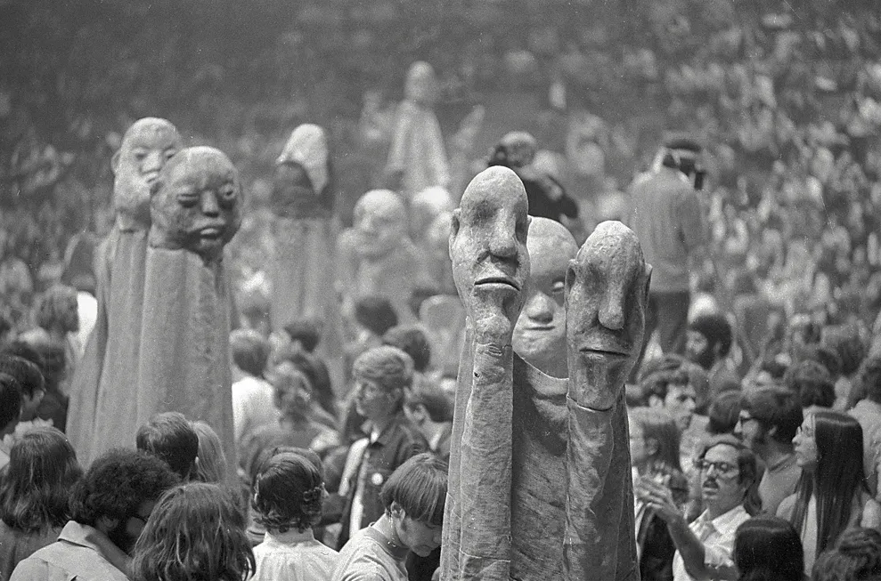 Bread & Puppet disciple puppets at Cornell University on the day when Daniel Berrigan escaped from the FBI inside one of them. Via medium.com.